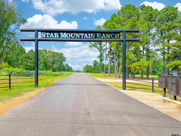 a view of a park with welcome board