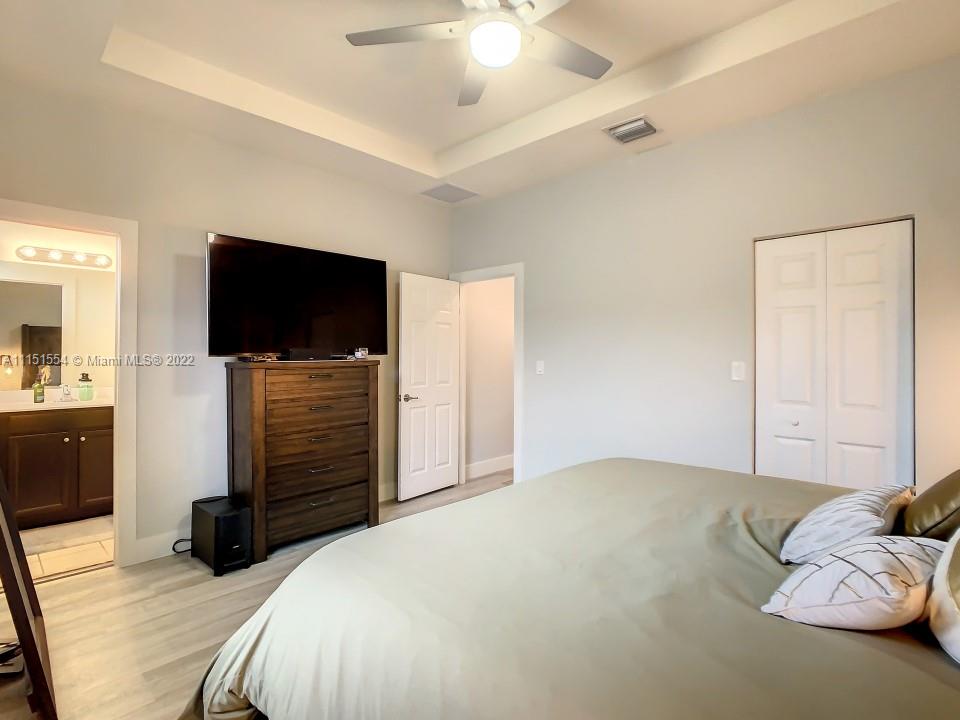 9326 West 33rd Lane Hialeah, FL 33018 - Photo 11 of 52 a bed room with a bed and a television