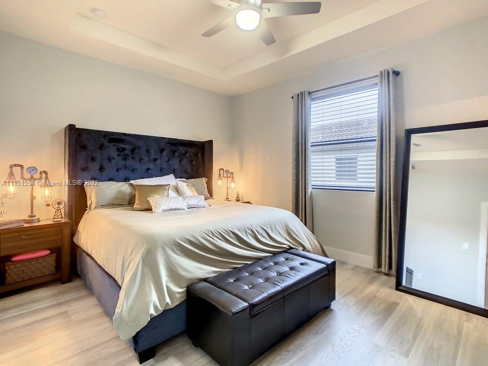9326 West 33rd Lane Hialeah, FL 33018 - Photo 14 of 52 a bedroom with a bed window and a dresser