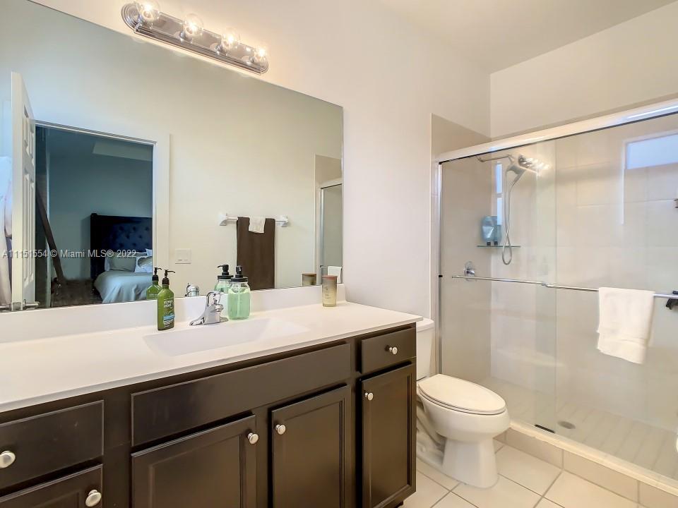 9326 West 33rd Lane Hialeah, FL 33018 - Photo 17 of 52 a bathroom with a sink a toilet and shower