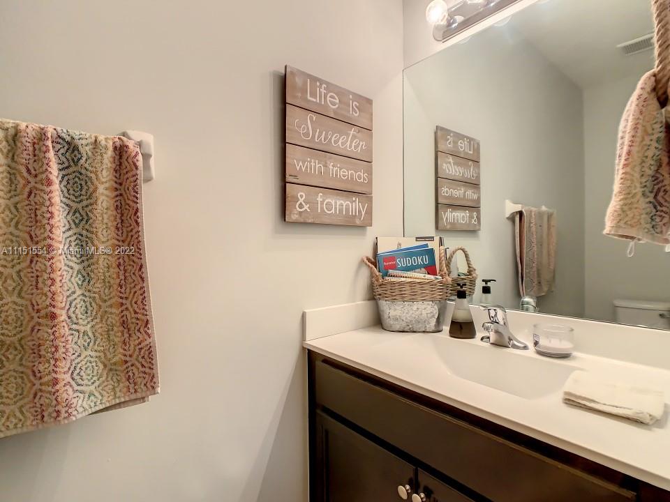9326 West 33rd Lane Hialeah, FL 33018 - Photo 20 of 52 a bathroom with a sink and a mirror