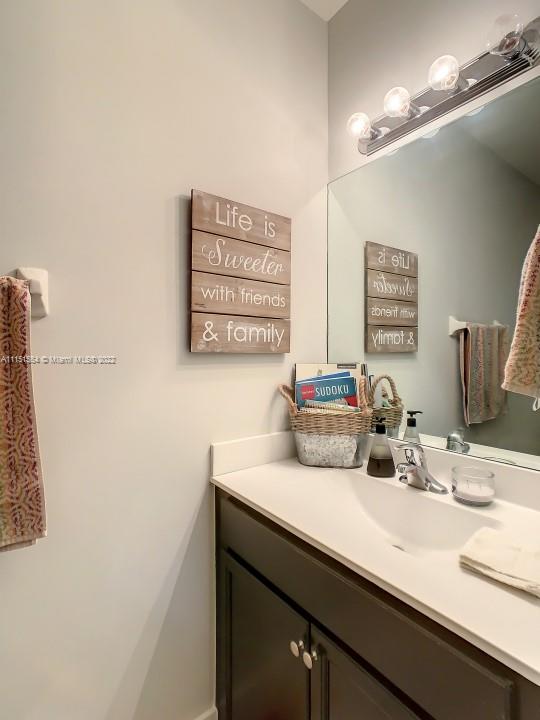 9326 West 33rd Lane Hialeah, FL 33018 - Photo 21 of 52 a bathroom with a sink and a mirror
