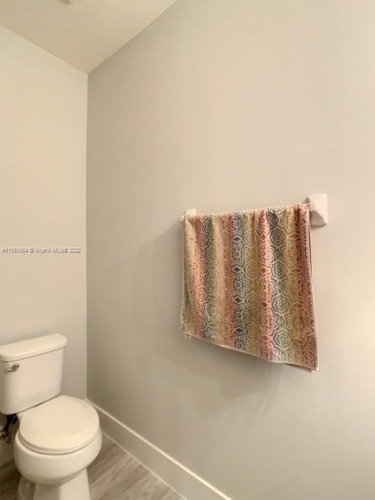 9326 West 33rd Lane Hialeah, FL 33018 - Photo 22 of 52 a white toilet sitting next to a white wall