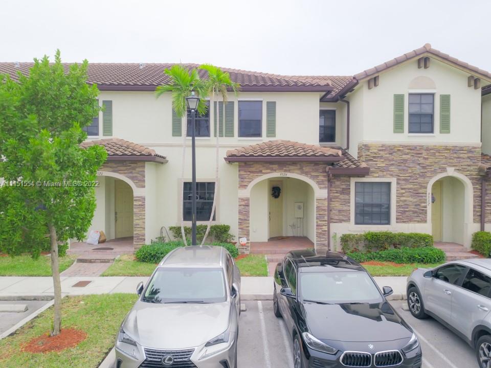 9326 West 33rd Lane Hialeah, FL 33018 - Photo 24 of 52 a front view of house with yard and green space