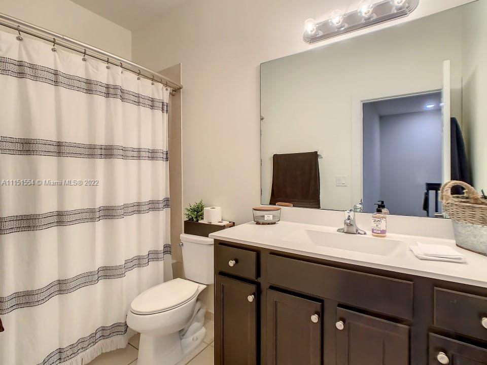 9326 West 33rd Lane Hialeah, FL 33018 - Photo 25 of 52 a bathroom with a sink toilet and shower