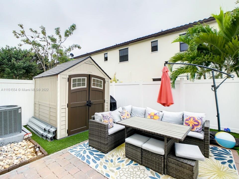 9326 West 33rd Lane Hialeah, FL 33018 - Photo 28 of 52 a outdoor space with patio furniture