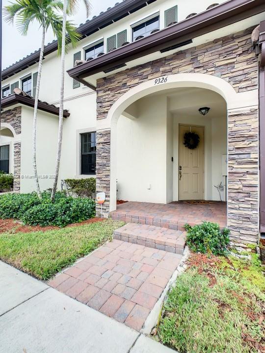 9326 West 33rd Lane Hialeah, FL 33018 - Photo 38 of 52 a front view of a house with garden