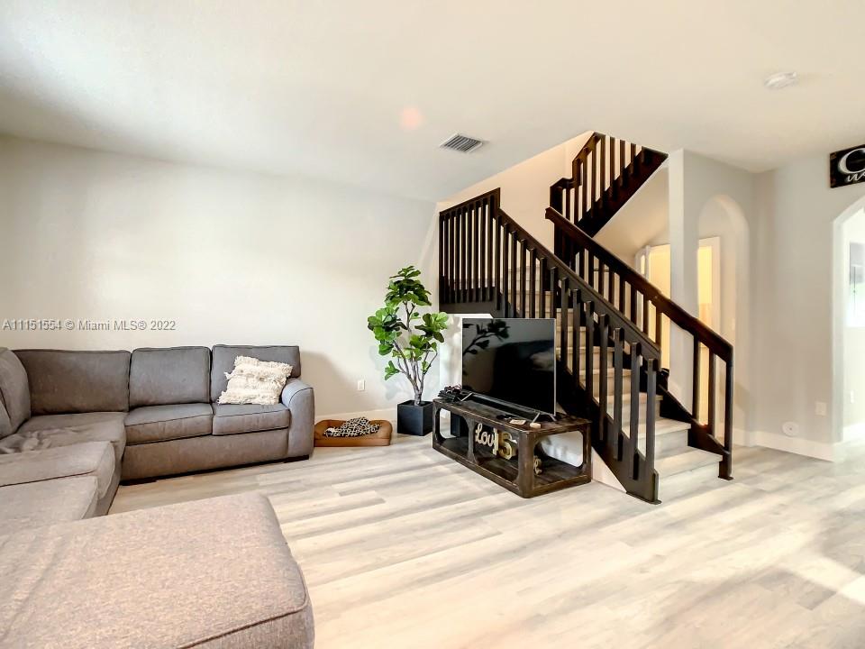 9326 West 33rd Lane Hialeah, FL 33018 - Photo 4 of 52 a view of living room filled with furniture and stairs