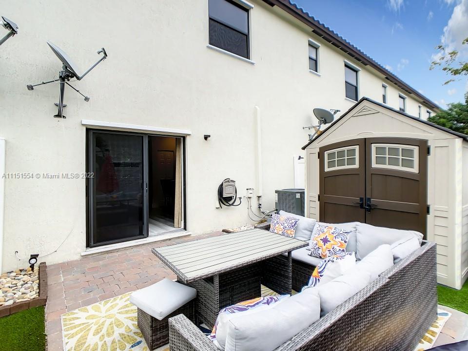 9326 West 33rd Lane Hialeah, FL 33018 - Photo 44 of 52 a terrace of a house with outdoor seating