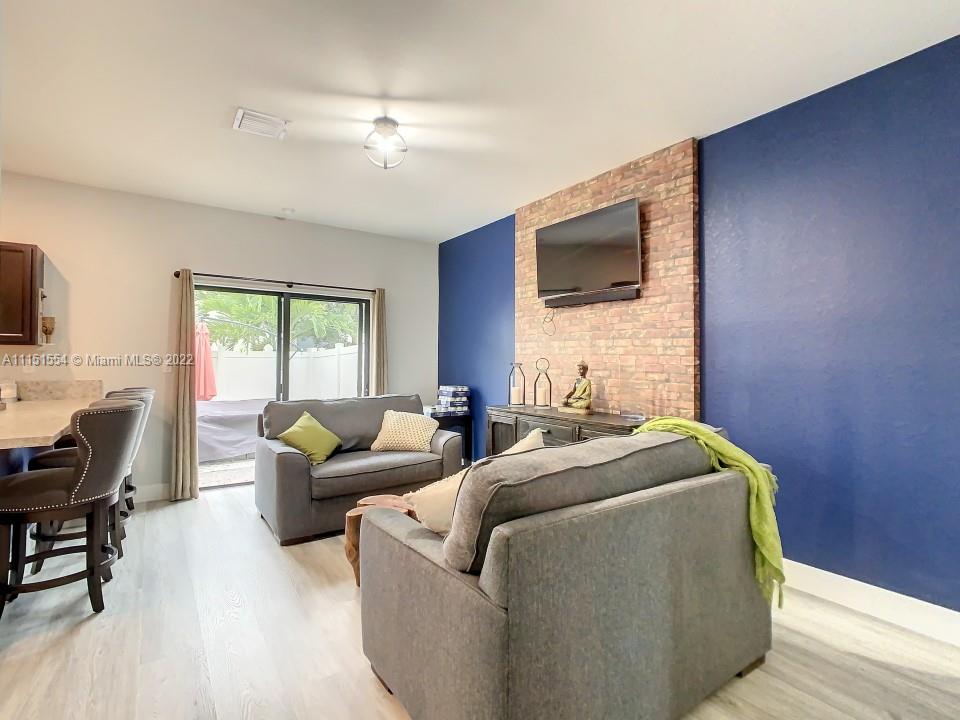 9326 West 33rd Lane Hialeah, FL 33018 - Photo 5 of 52 a living room with furniture and a flat screen tv