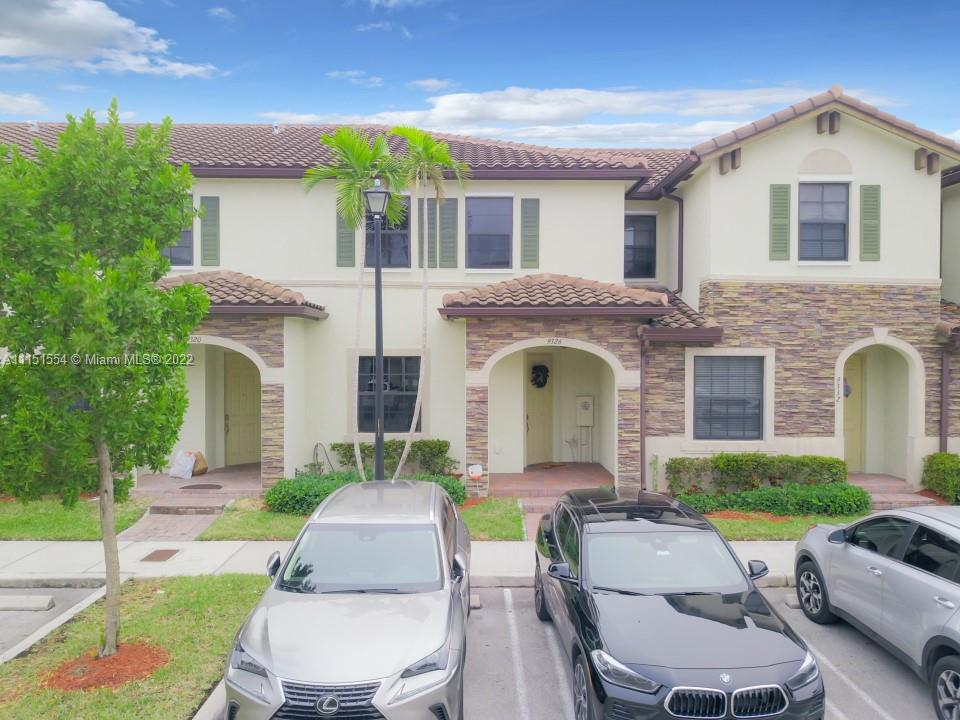 9326 West 33rd Lane Hialeah, FL 33018 - Photo 51 of 52 a front view of house with yard and green space