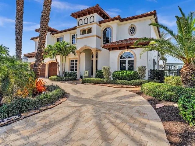 a view of a patio with chairs and a table