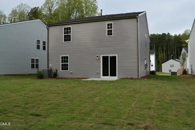 a view of a backyard of the house