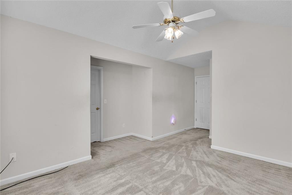7243 April Court Morrow, GA 30260 - Photo 16 of 29 a view of an empty room with a ceiling fan