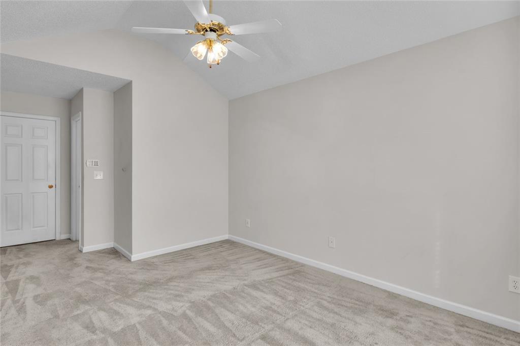 7243 April Court Morrow, GA 30260 - Photo 17 of 29 a view of a chandelier fan in a room