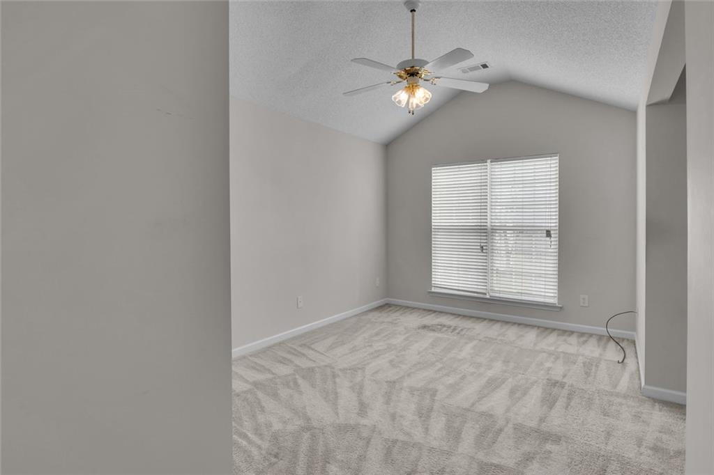 7243 April Court Morrow, GA 30260 - Photo 19 of 29 an empty room with windows and fan