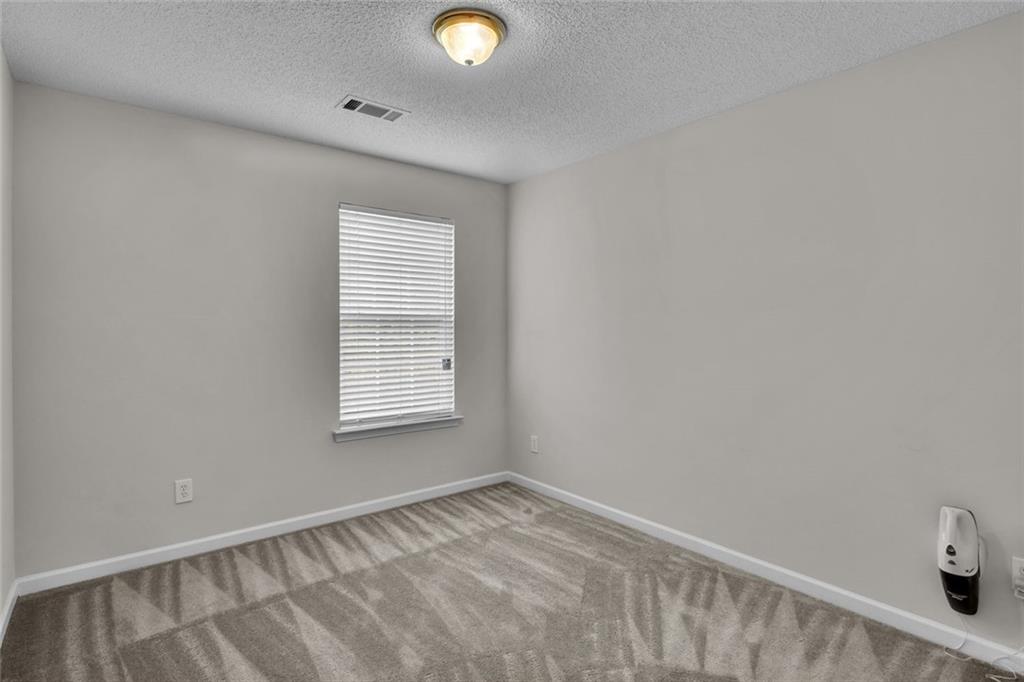 7243 April Court Morrow, GA 30260 - Photo 20 of 29 a view of an empty room and window
