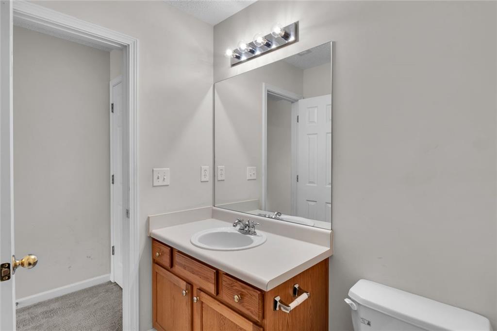 7243 April Court Morrow, GA 30260 - Photo 26 of 29 a bathroom with a sink and a toilet