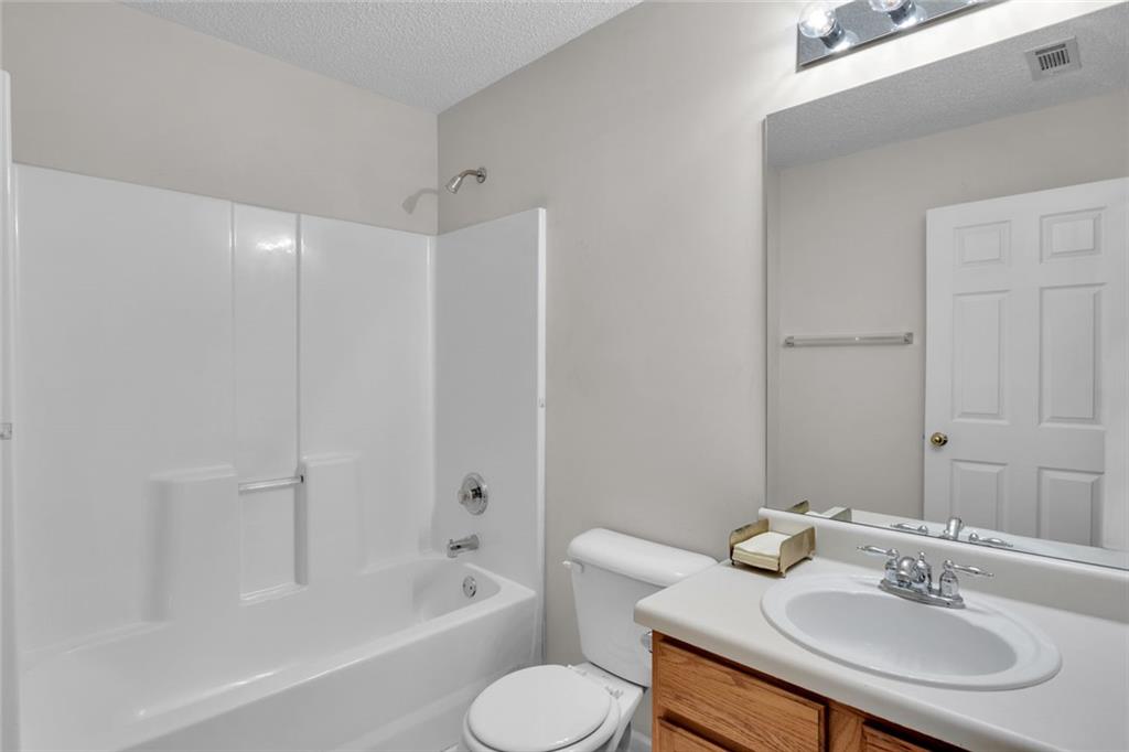 7243 April Court Morrow, GA 30260 - Photo 27 of 29 a bathroom with a sink toilet and shower