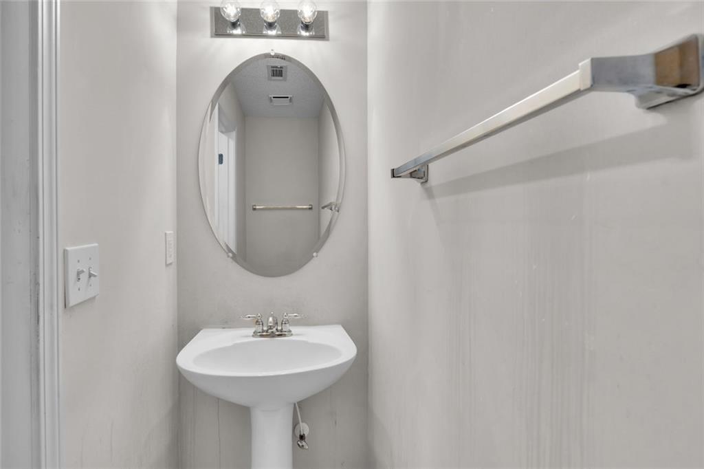 7243 April Court Morrow, GA 30260 - Photo 28 of 29 a bathroom with a sink and a mirror