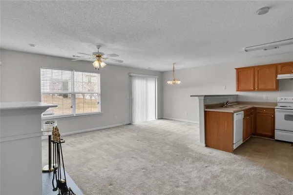 a view of a kitchen with a sink cabinets and window