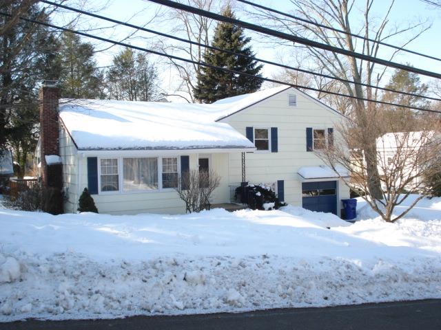 2 Merrill Road Norwalk, CT 06851 - Photo 1 of 1 a view of a house with a yard covered in snow