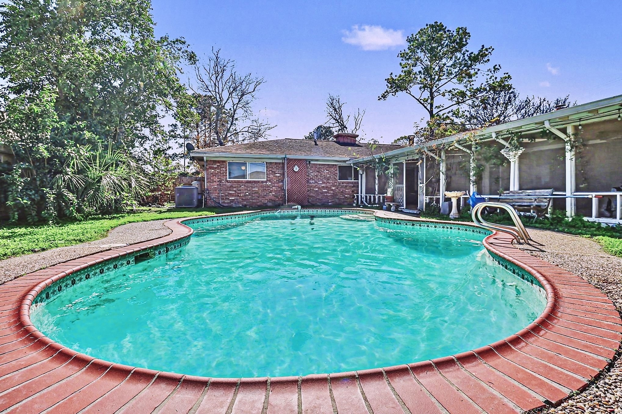 This AS-IS corner lot gem is ready for Pinterest-worthy upgrades.  A few noteworthy features include NO HOA, a huge bonus room, hardwood floors, and an over 40-foot-long screened-in porch overlooking the pool.
