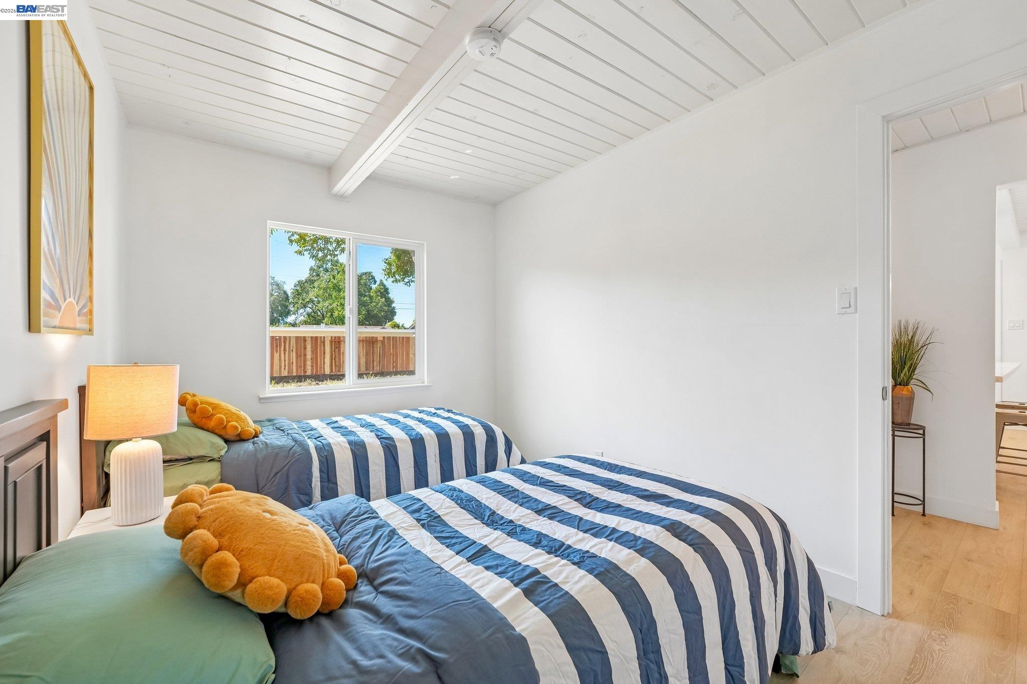 606 West 9th Street Santa Rosa, CA 95401 - Photo 35 of 52 a bedroom with two beds and a chair