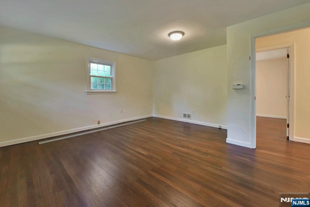 4 Marconi Street Tenafly, NJ 07670 - Photo 7 of 35 an empty room with wooden floor and windows