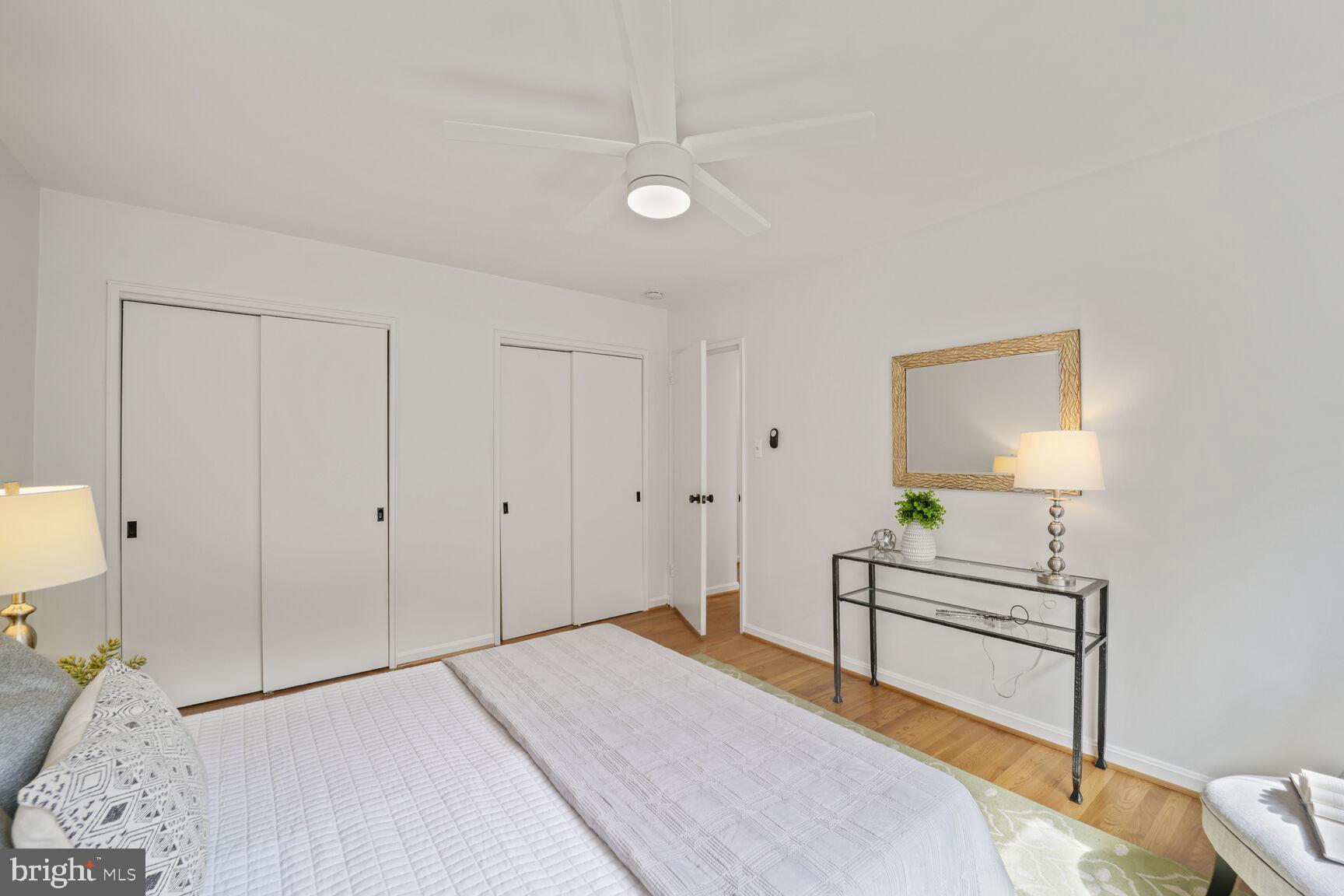 4114 Davis Place Northwest, Unit 311 Washington, DC 20007 - Photo 10 of 37 a bedroom with a bed and a dresser
