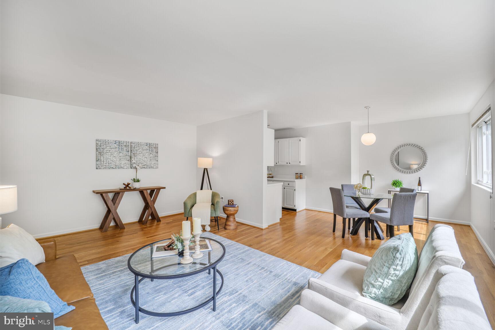 4114 Davis Place Northwest, Unit 311 Washington, DC 20007 - Photo 37 of 37 a living room with furniture and wooden floor