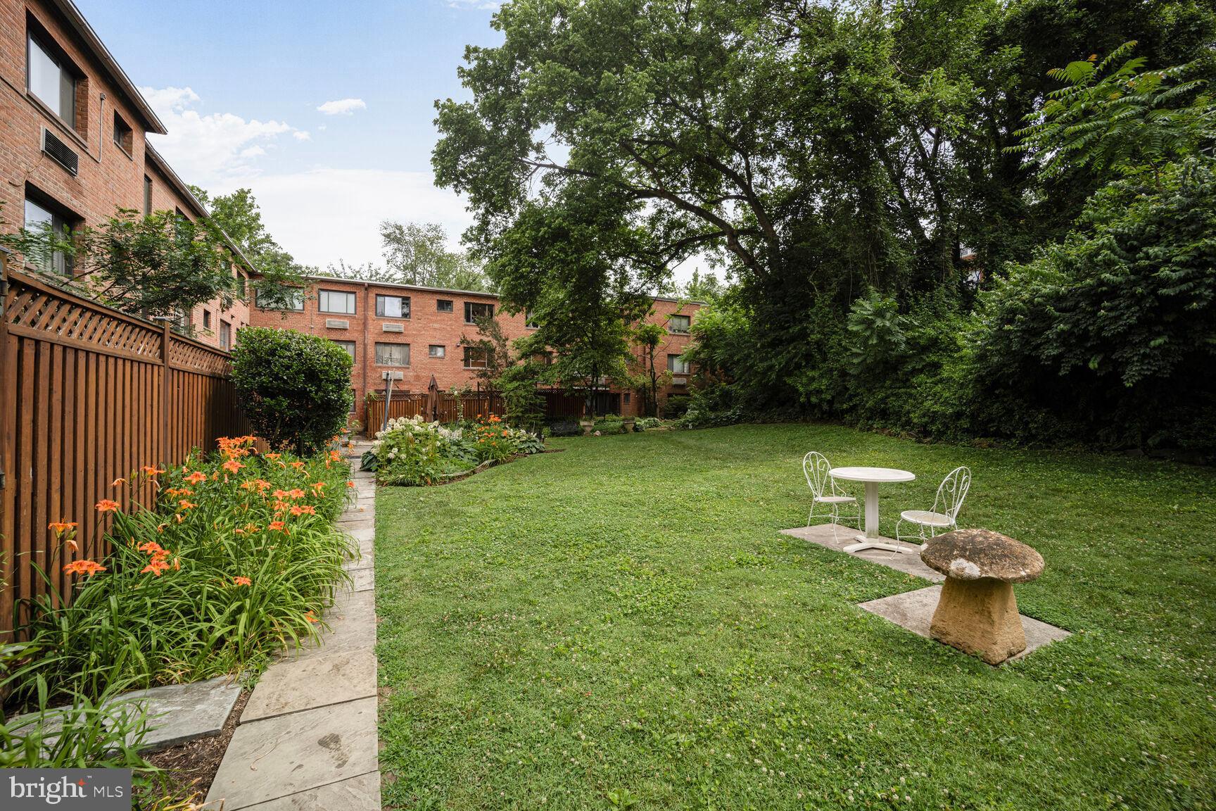 4114 Davis Place Northwest, Unit 311 Washington, DC 20007 - Photo 21 of 37 a view of a backyard with garden and plants