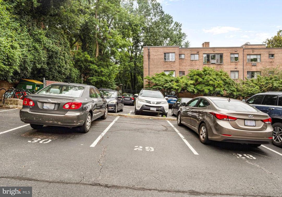 4114 Davis Place Northwest, Unit 311 Washington, DC 20007 - Photo 22 of 37 a view of cars parked in front of a house