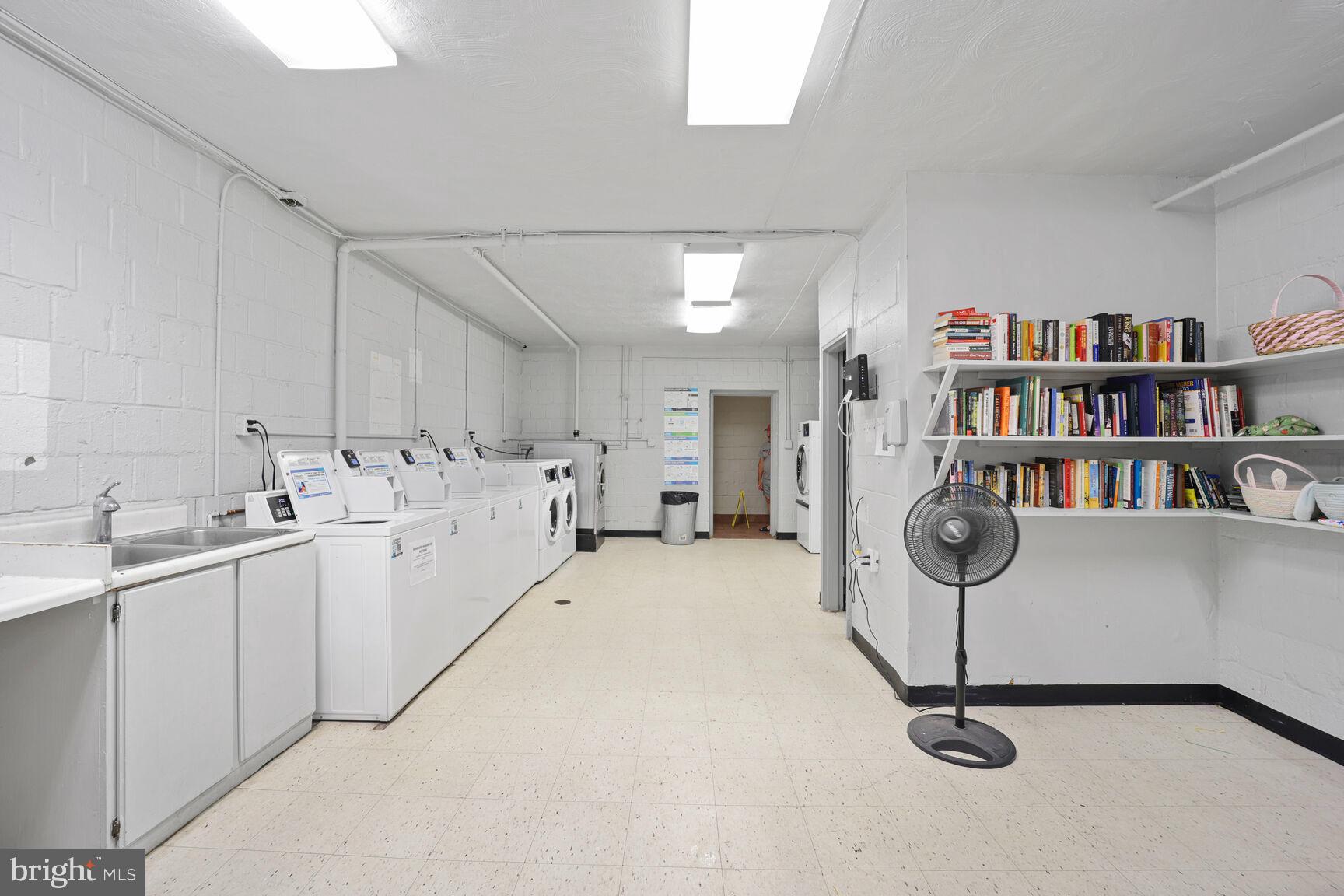 4114 Davis Place Northwest, Unit 311 Washington, DC 20007 - Photo 24 of 37 a kitchen with sink cabinets and appliances