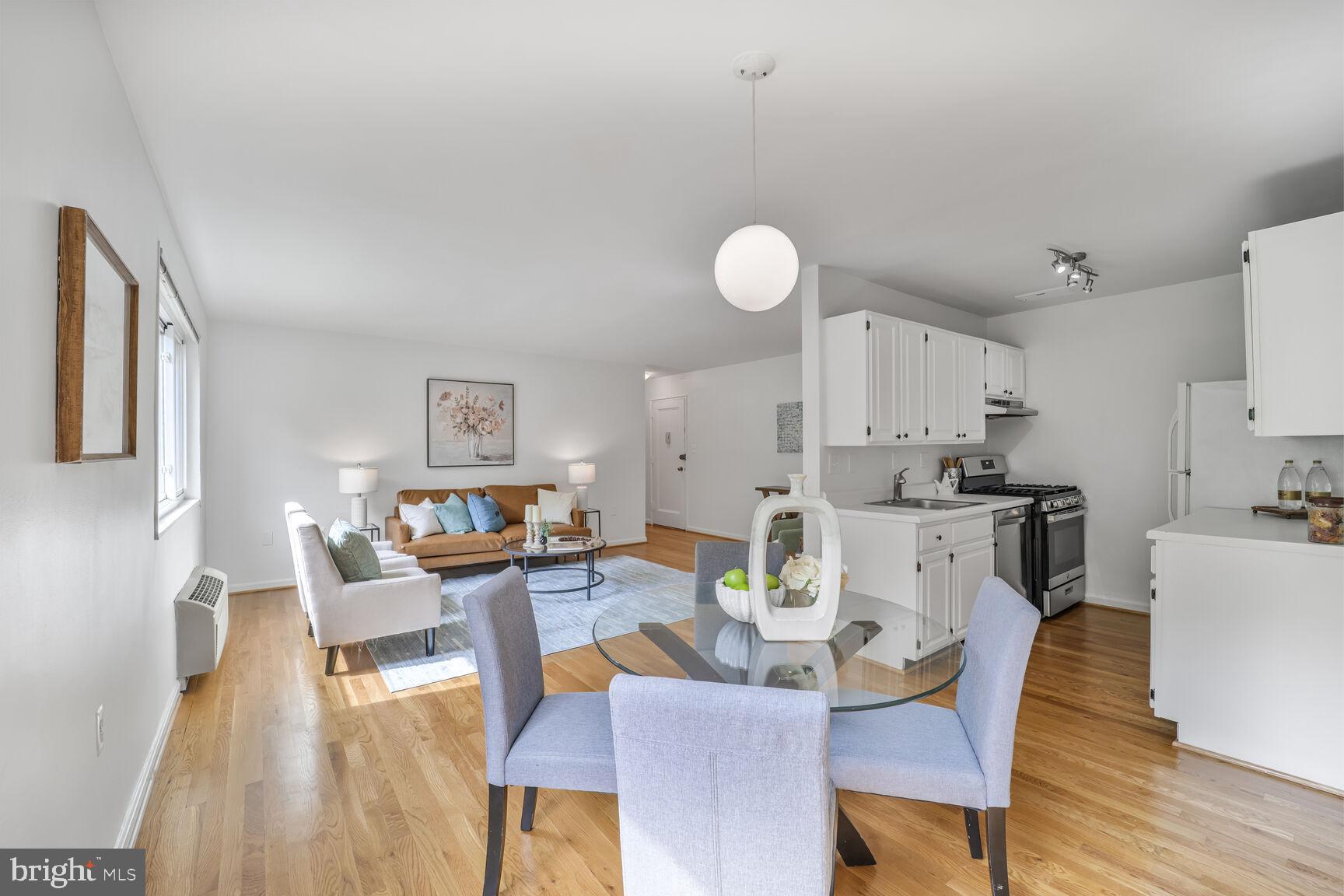 4114 Davis Place Northwest, Unit 311 Washington, DC 20007 - Photo 4 of 37 a view of a dining room with furniture and wooden floor