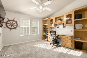 3301 South Goldfield Road, Unit 4086 Apache Junction, AZ 85119 - Photo 20 of 41 a view of a workspace with furniture and a window