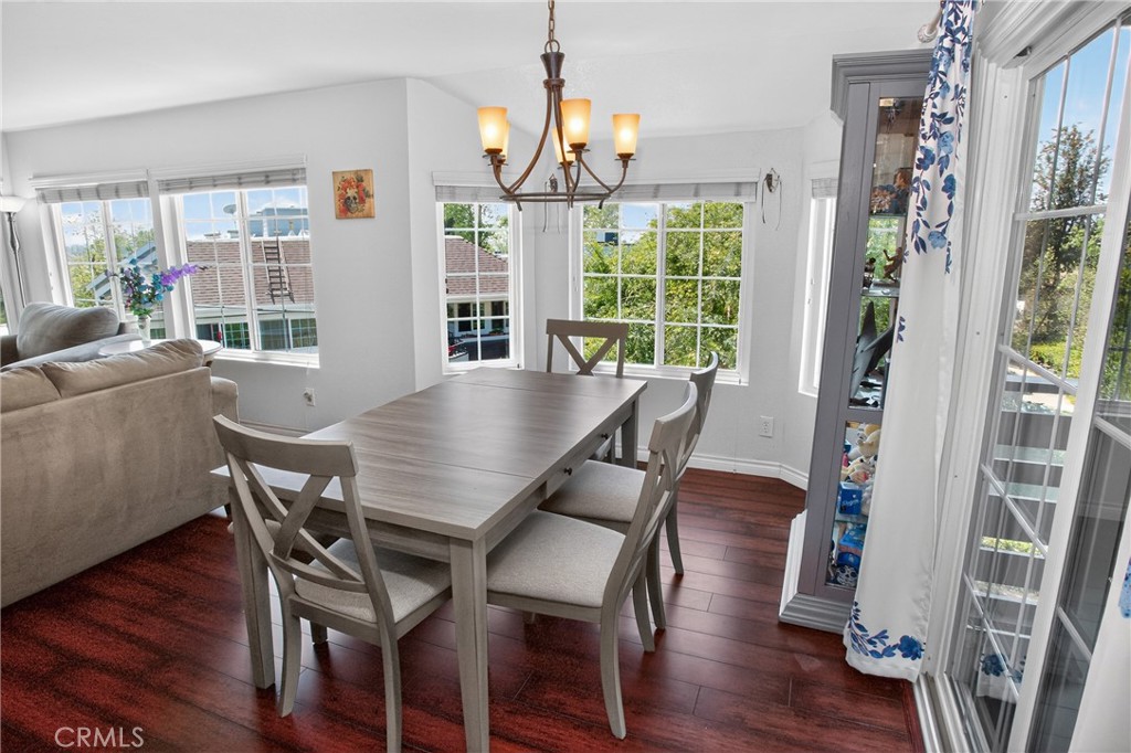 1083 Lakeview Terrace Azusa, CA 91702 - Photo 15 of 36 a view of a dining room with furniture wooden floor and chandelier