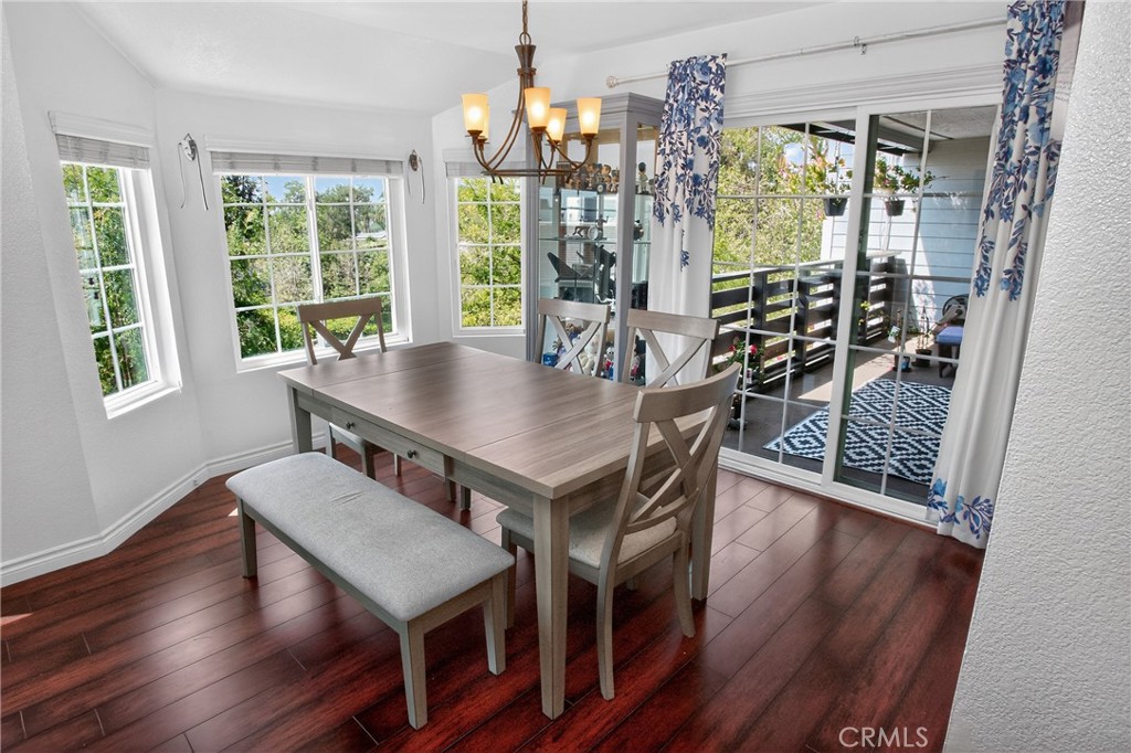 1083 Lakeview Terrace Azusa, CA 91702 - Photo 16 of 36 a view of a dining room with furniture window and wooden floor