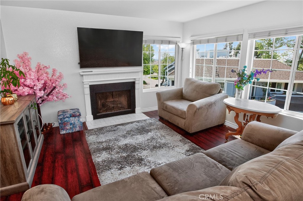 1083 Lakeview Terrace Azusa, CA 91702 - Photo 3 of 36 a living room with furniture a flat screen tv and a fireplace