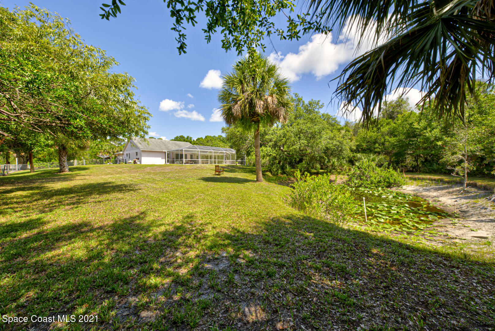 2225 Corey Road Malabar, FL 32950 - Photo 12 of 62 a view of an swimming pool with a yard