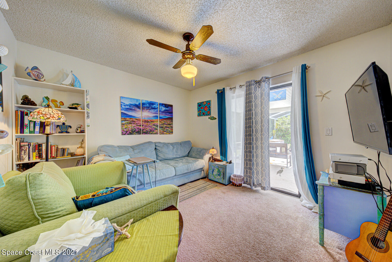 2225 Corey Road Malabar, FL 32950 - Photo 21 of 62 a living room with furniture and a flat screen tv