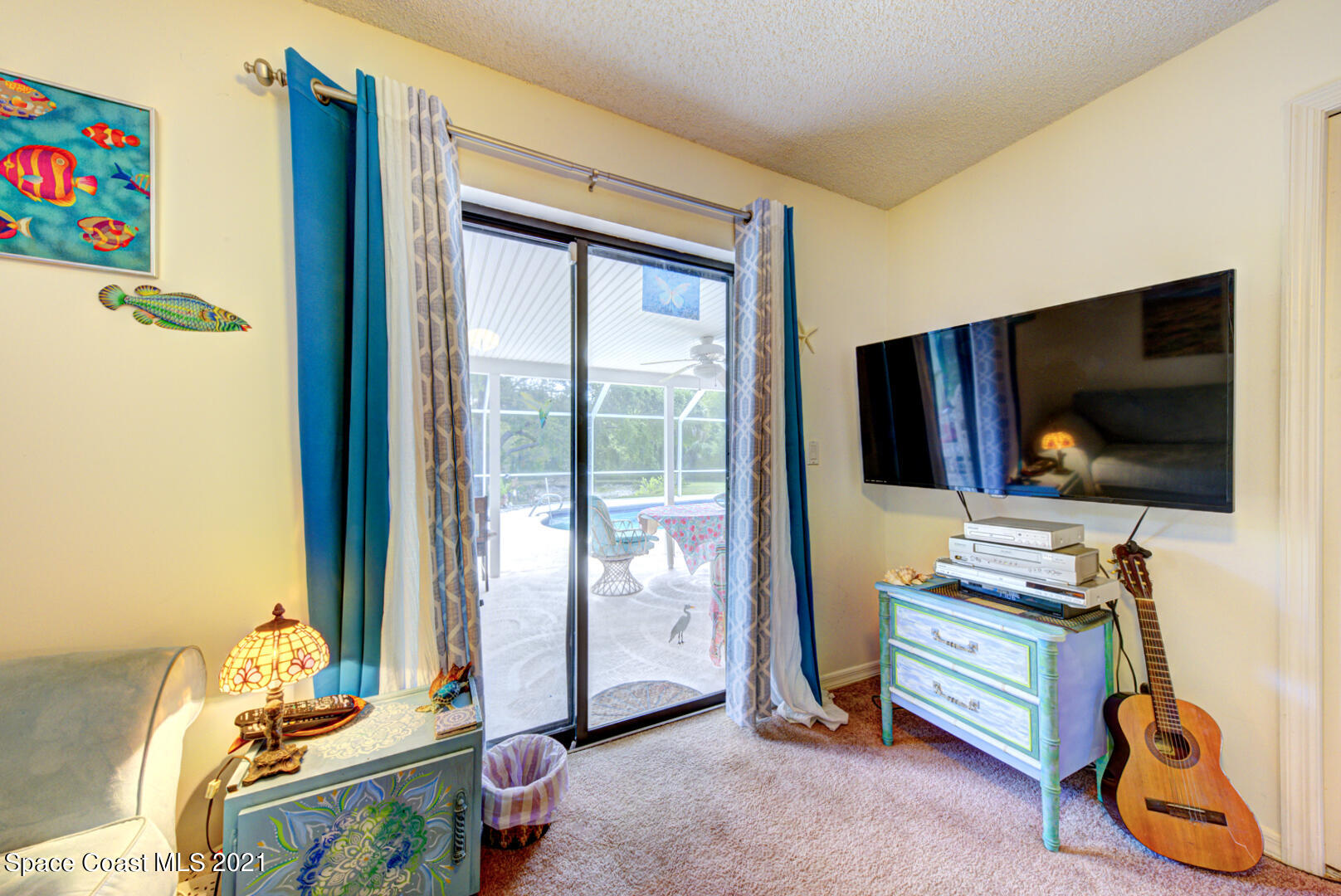 2225 Corey Road Malabar, FL 32950 - Photo 22 of 62 a room with window and flat screen tv