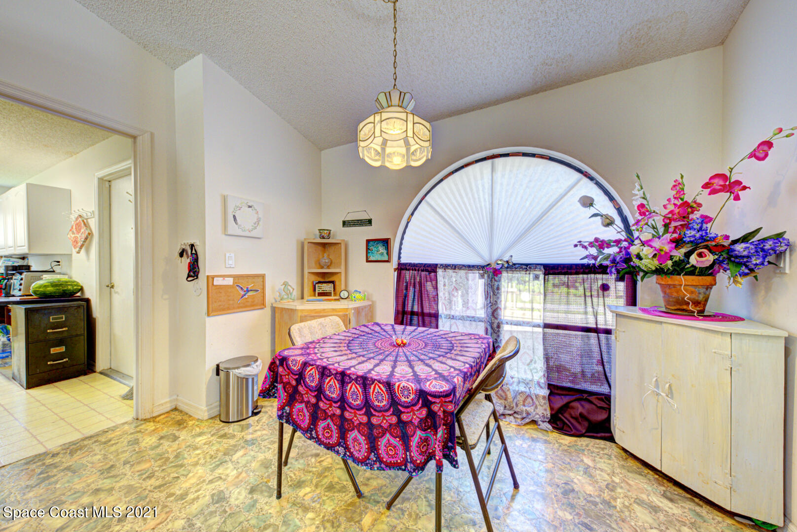 2225 Corey Road Malabar, FL 32950 - Photo 26 of 62 a view of a dining room with furniture and chandelier