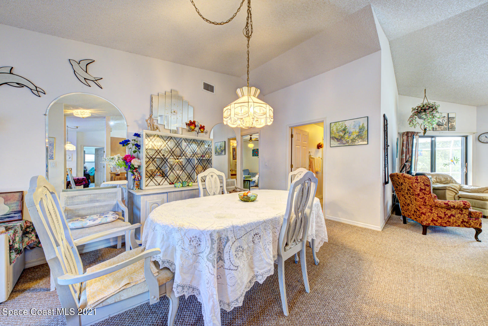 2225 Corey Road Malabar, FL 32950 - Photo 28 of 62 a view of a dining room and hall with furniture