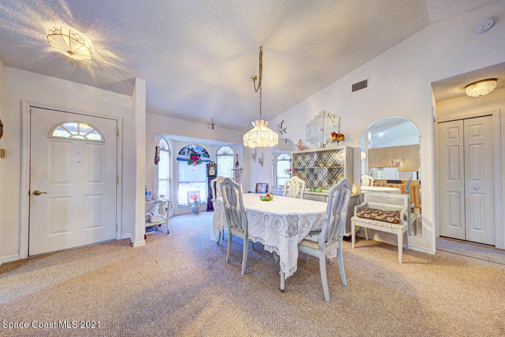 2225 Corey Road Malabar, FL 32950 - Photo 29 of 62 a view of a dining room with furniture window and entryway