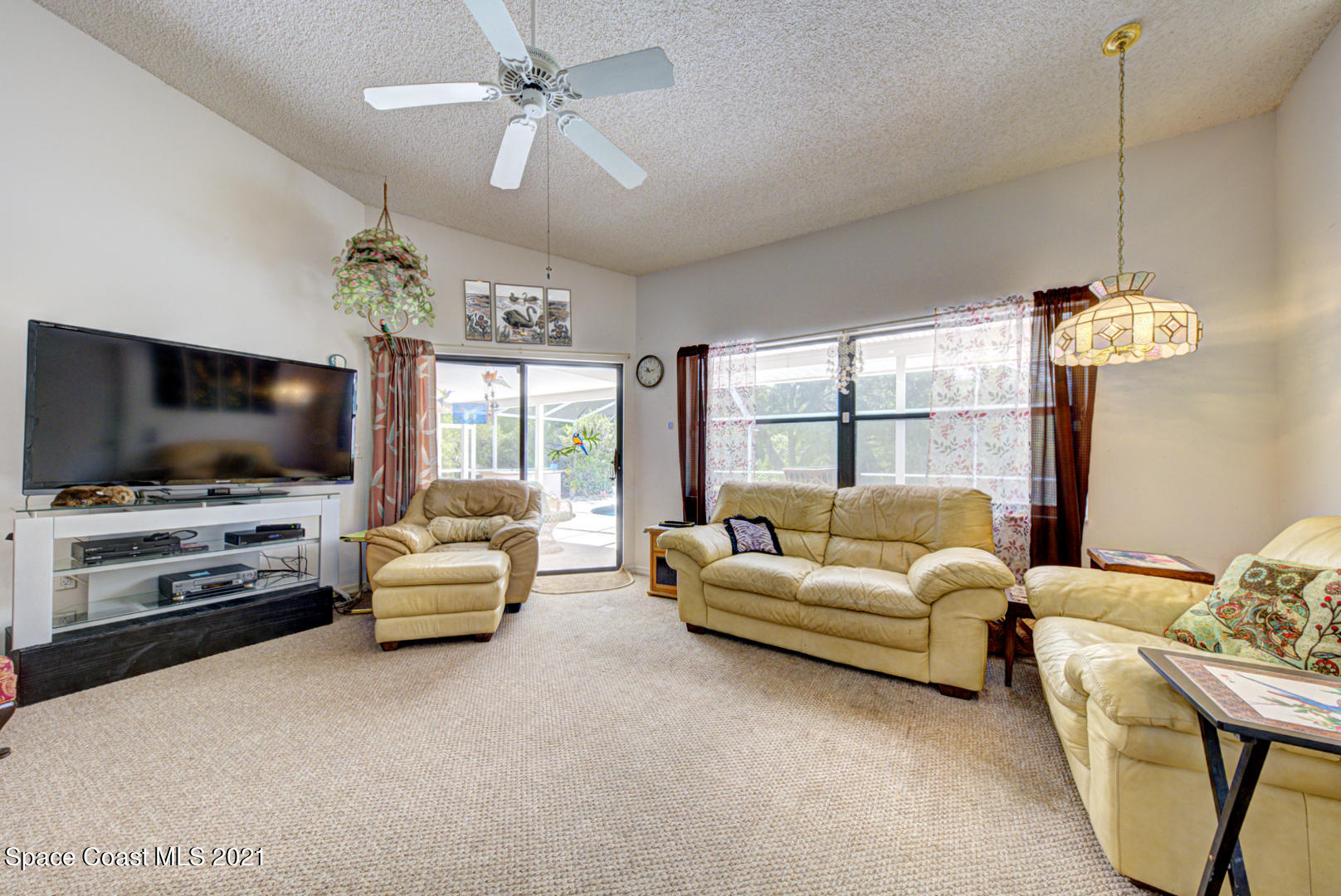 2225 Corey Road Malabar, FL 32950 - Photo 38 of 62 a living room with furniture and a flat screen tv