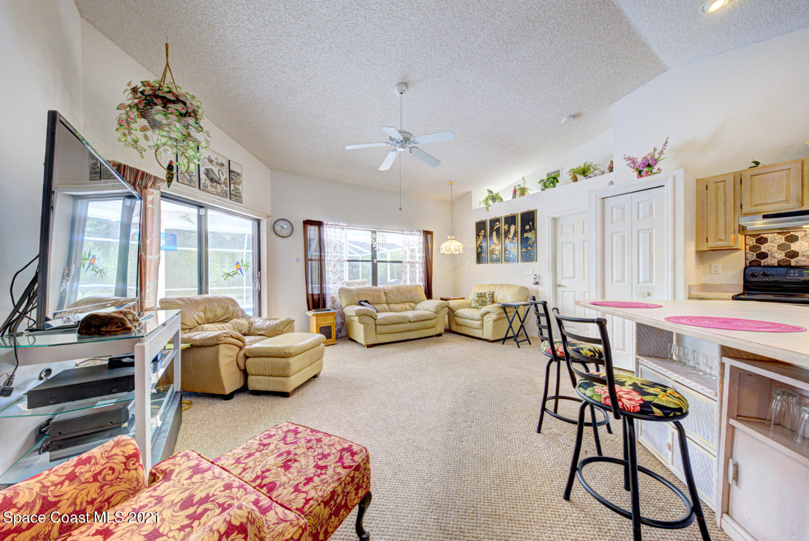 2225 Corey Road Malabar, FL 32950 - Photo 40 of 62 a living room with furniture and a large window