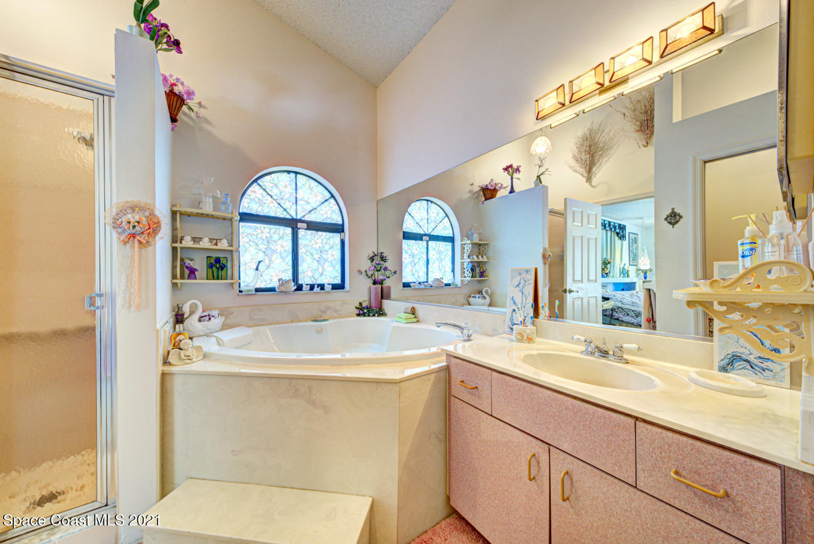 2225 Corey Road Malabar, FL 32950 - Photo 42 of 62 a bathroom with a sink and a mirror