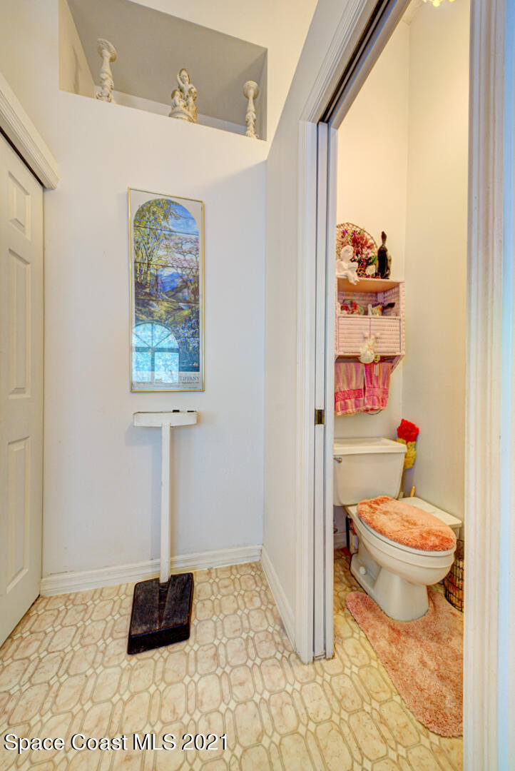 2225 Corey Road Malabar, FL 32950 - Photo 43 of 62 a bathroom with a toilet and a shower