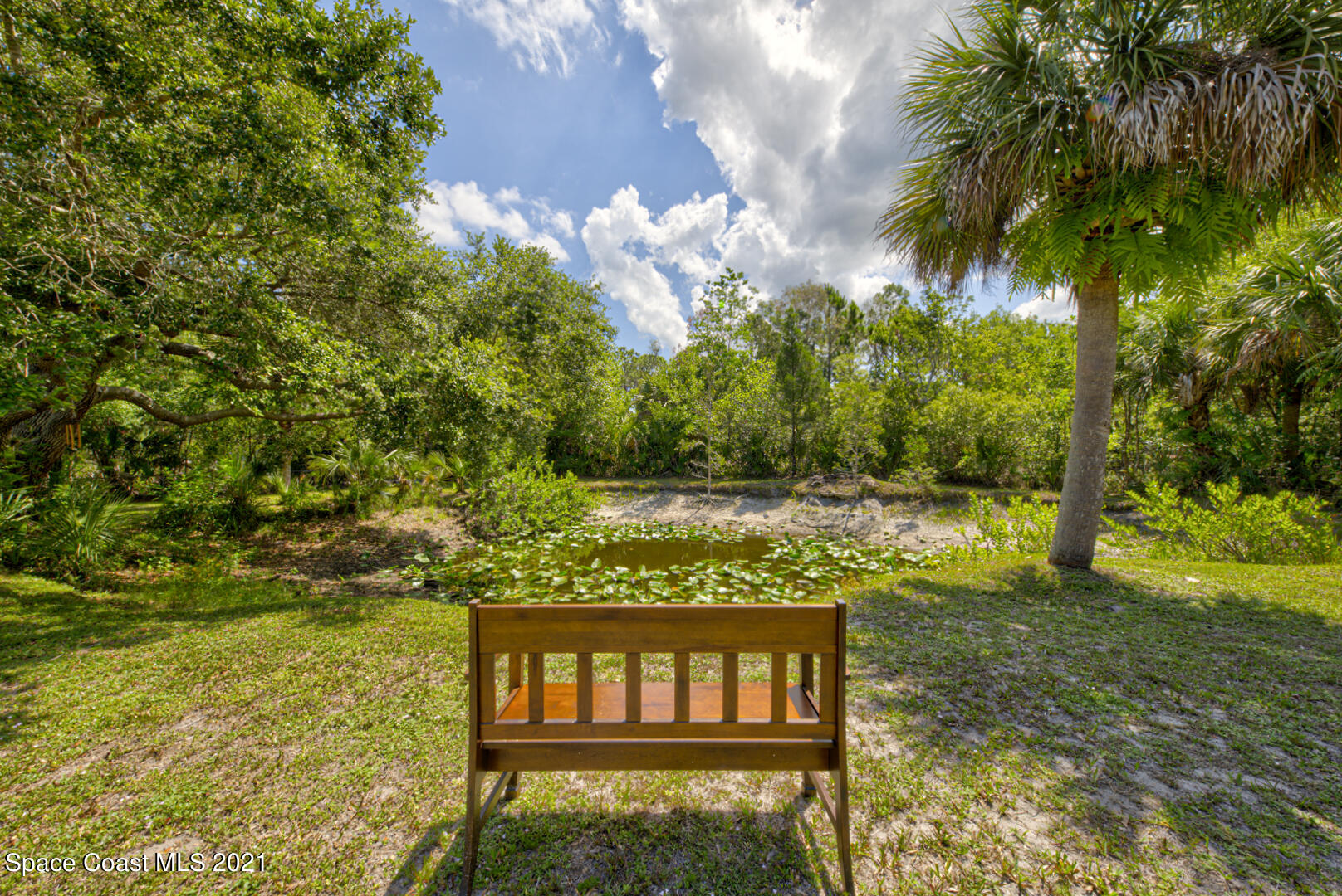 2225 Corey Road Malabar, FL 32950 - Photo 51 of 62 relax by the pond